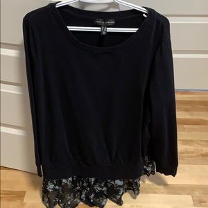 Black top with floral detail on the bottom